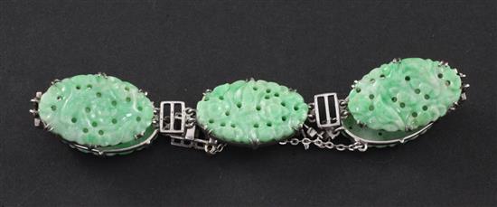 A Chinese jadeite and silver mounted bracelet, 20th century, each jadeite plaque approx. 2.5cm